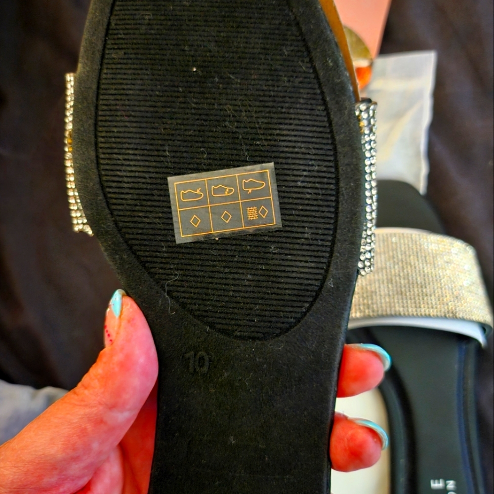 Black slides with rhinestone strap from Journee Collection.
